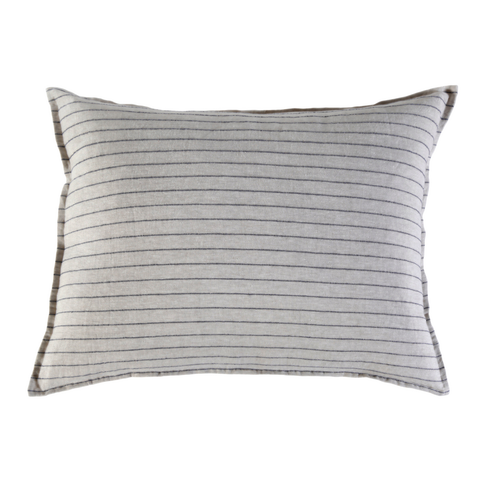 Pom Pom at Home Blake white and ocean-colored decorative sham with pom pom trim for bed or sofa decor.