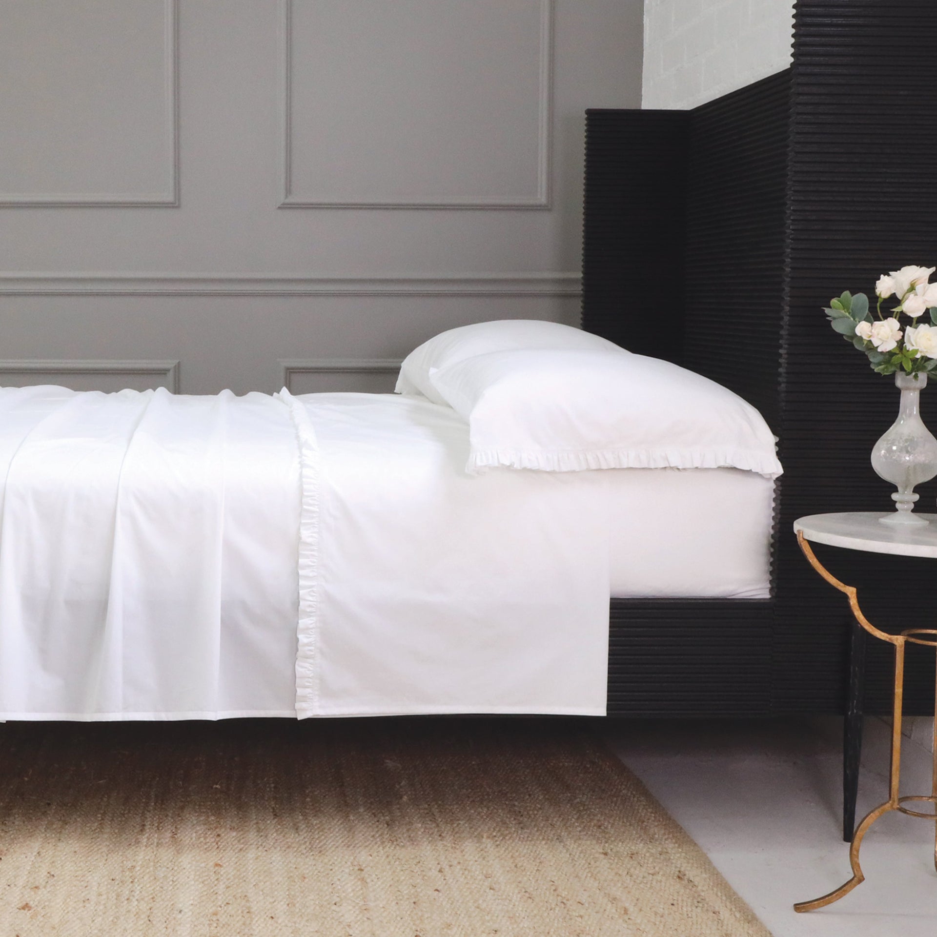 Pom Pom at Home Audrey ruffle cotton percale sheet set with elegant ruffle details on a king-size bed.