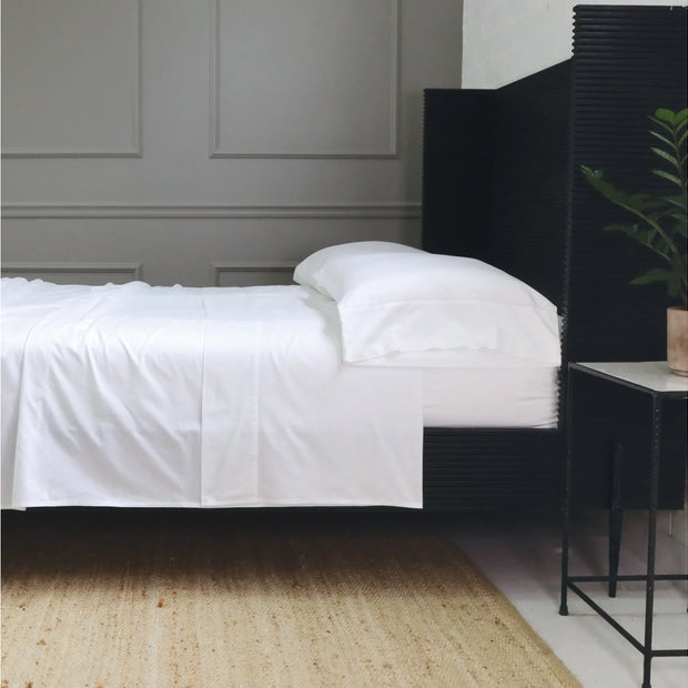Pom Pom at Home hemstitch cotton sateen sheet set in king size, white with decorative pom-pom accents and elegant hemstitch detailing.