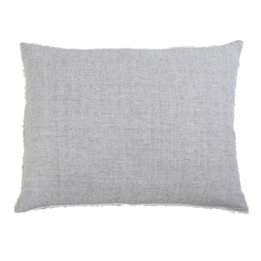 Navy throw pillow from Pom Pom at Home Logan collection with plush fabric and decorative pom pom accents.