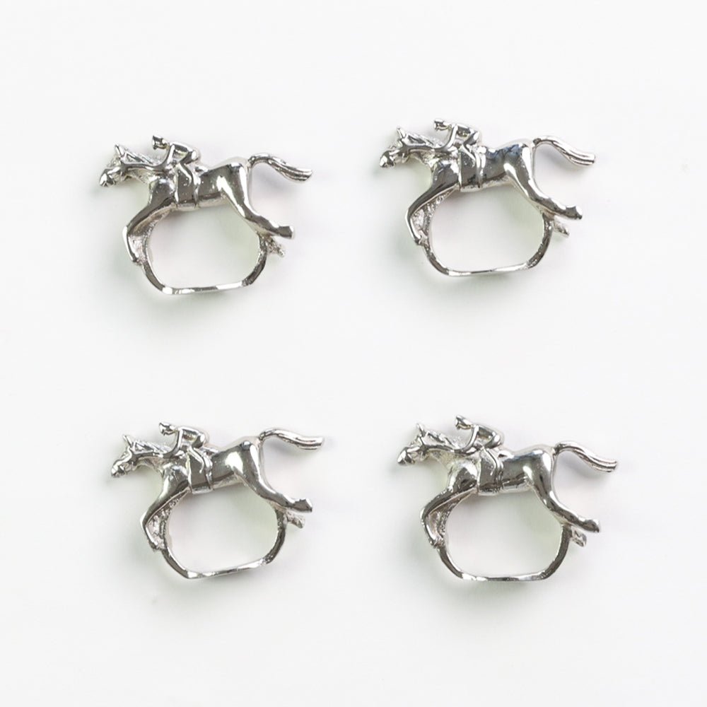 Set of four silver horse jockey napkin rings by Pomegranate, featuring detailed equestrian design for elegant table settings.
