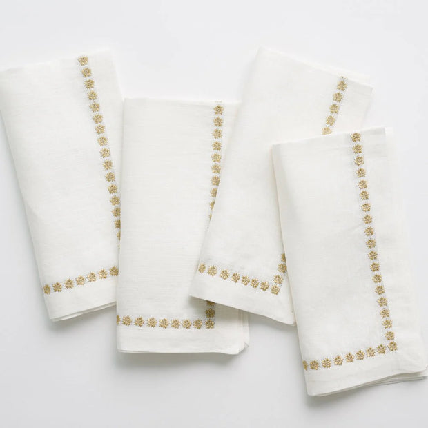 Set of four India Hicks linen napkins from Pomegranate, elegant table linens with a soft, natural fabric design.