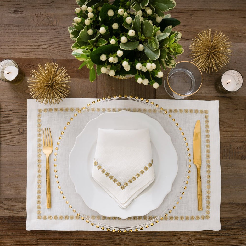 Set of four India Hicks linen placemats by Pomegranate, featuring elegant, lightweight table linens for dining decor.
