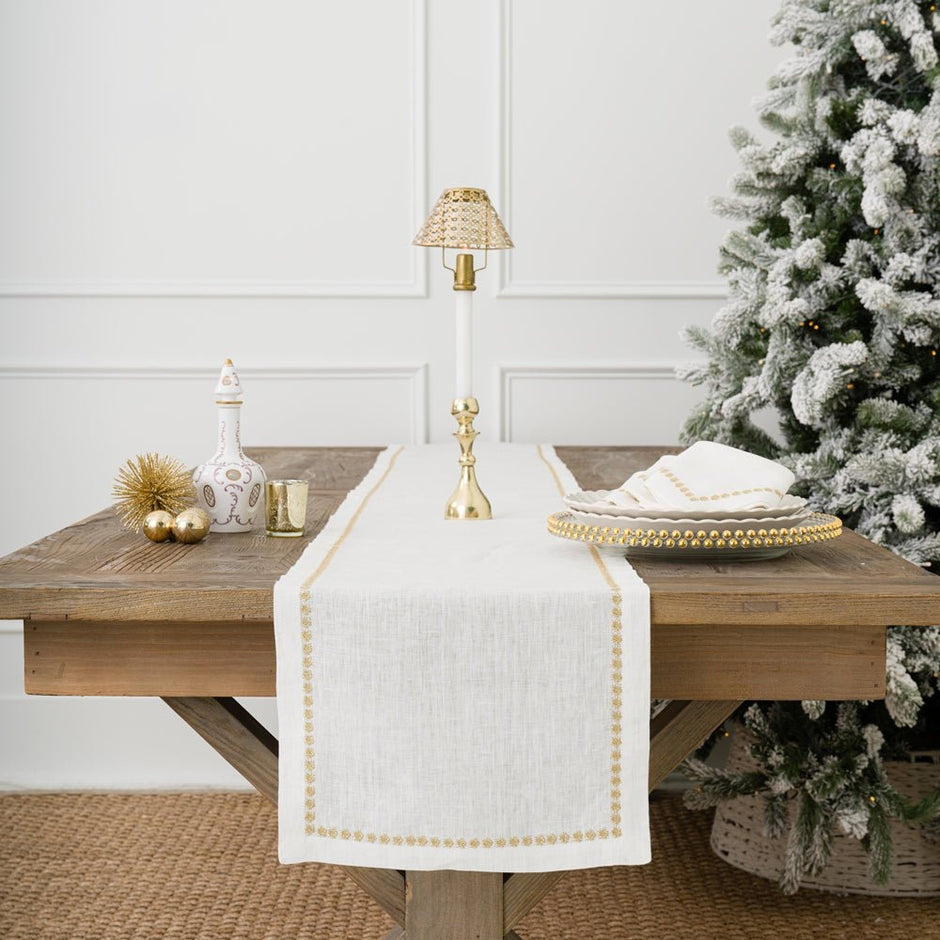 India Hicks linen table runner from Pomegranate featuring elegant, natural-colored linen fabric for sophisticated table decor.