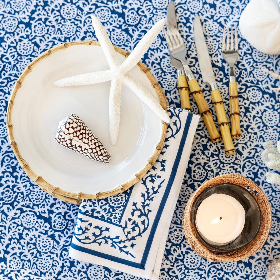 Dark blue round tapestry tablecloth by Pomegranate, featuring intricate floral patterns for elegant table decoration.