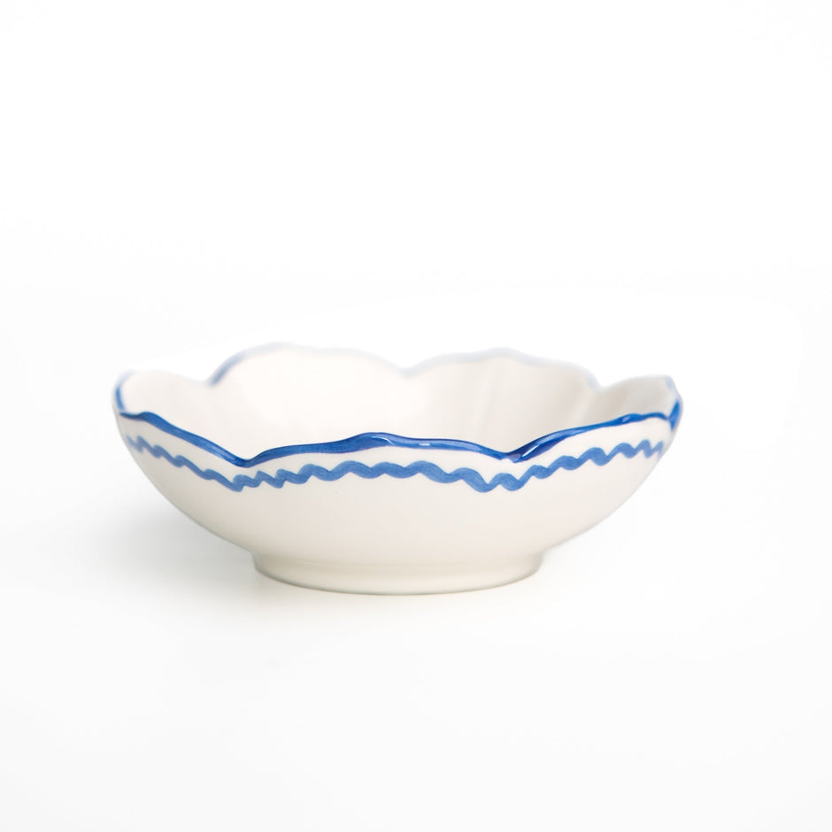 Set of four Pomegranate Trio Sketch Blue small bowls, perfect for table linens and serving. Elegant and vibrant design.
