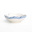 Set of four Pomegranate Trio Sketch Blue small bowls, perfect for table linens and serving. Elegant and vibrant design.