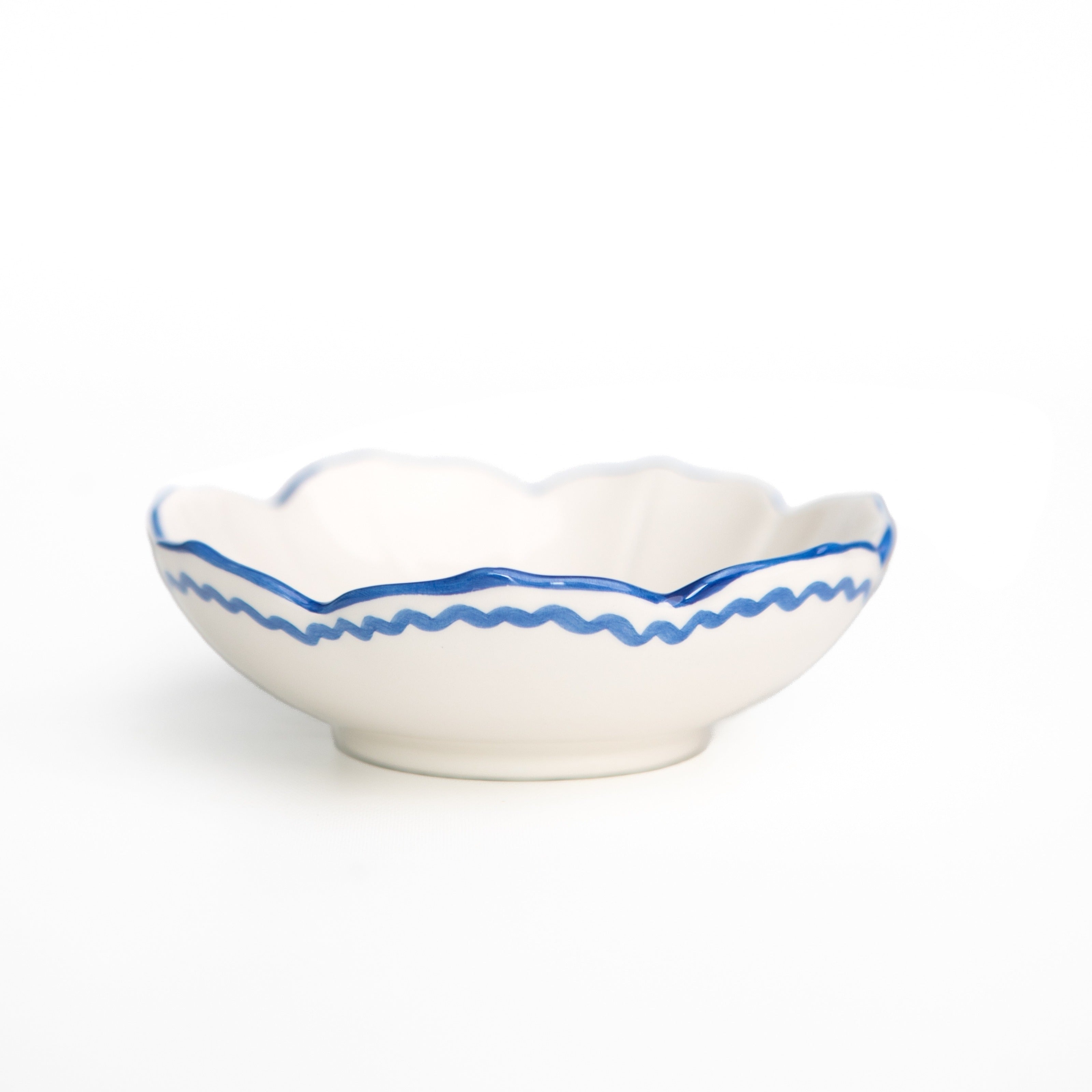 Set of four Pomegranate Trio Sketch Blue small bowls, perfect for table linens and serving. Elegant and vibrant design.
