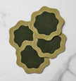 Set of six Sferra Ondulato cocktail napkins in forest celadon with elegant wave pattern, perfect for upscale gatherings.