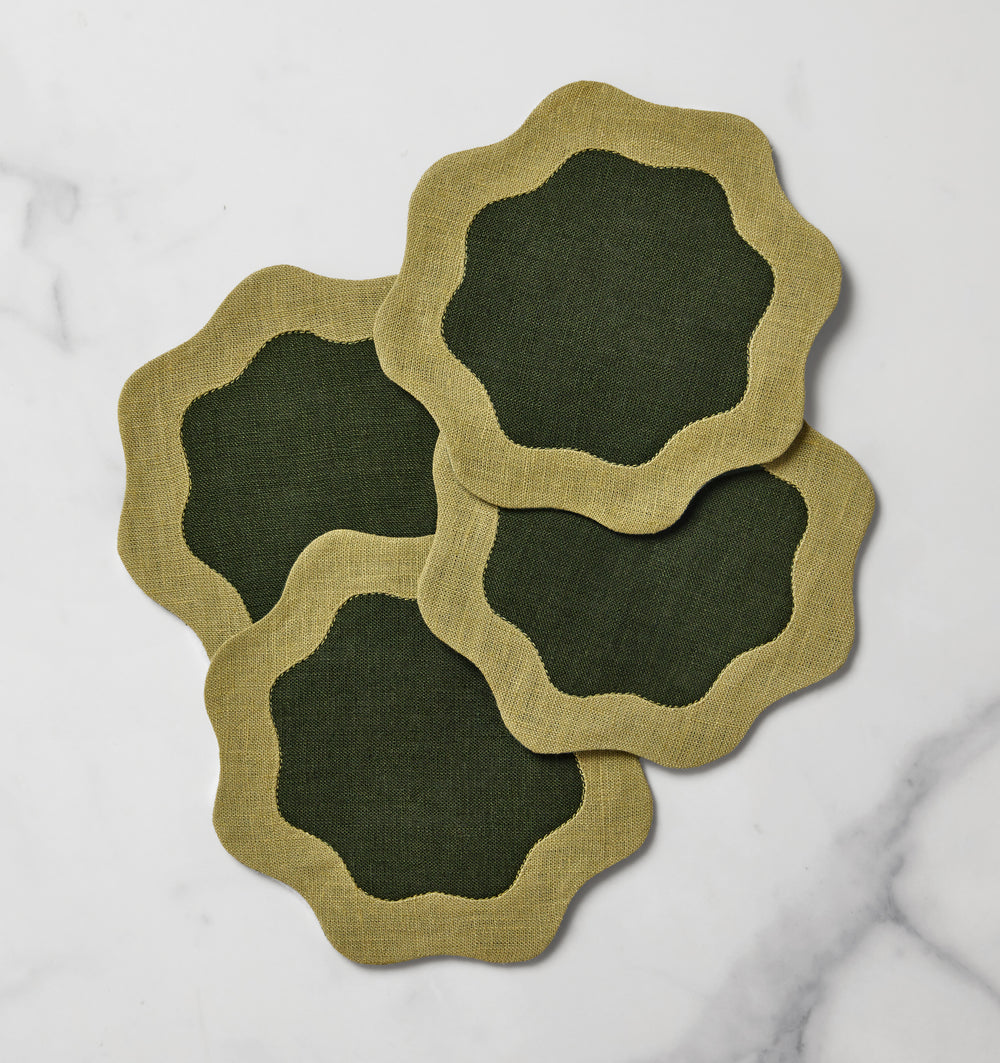 Set of six Sferra Ondulato cocktail napkins in forest celadon with elegant wave pattern, perfect for upscale gatherings.