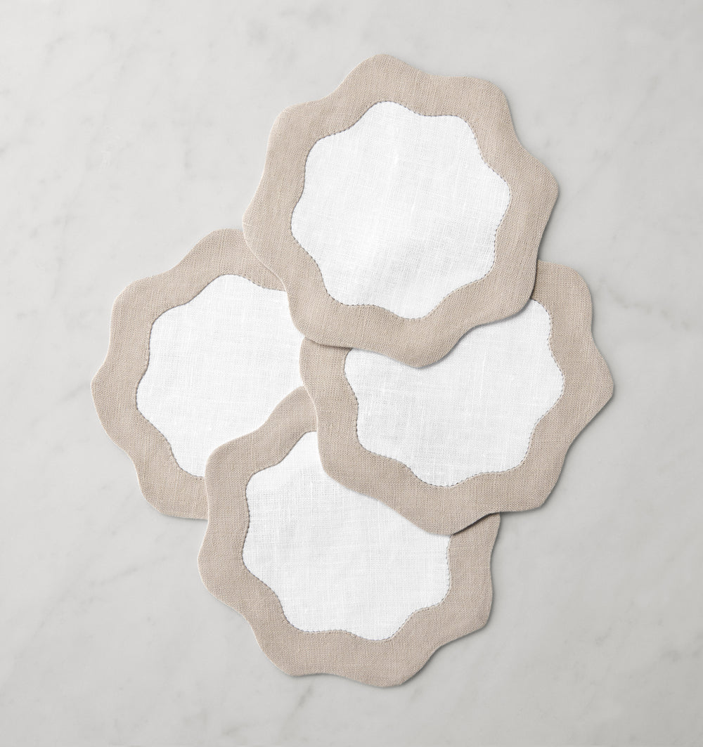Set of six Sferra Ondulato cocktail napkins in forest celadon, featuring elegant wave design, perfect for upscale gatherings.
