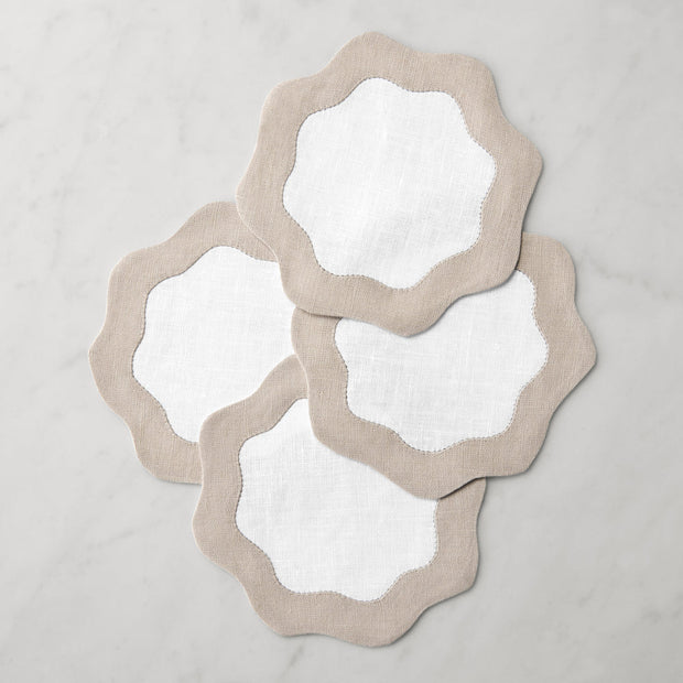 Set of six Sferra Ondulato cocktail napkins in forest celadon, featuring elegant wave design, perfect for upscale gatherings.