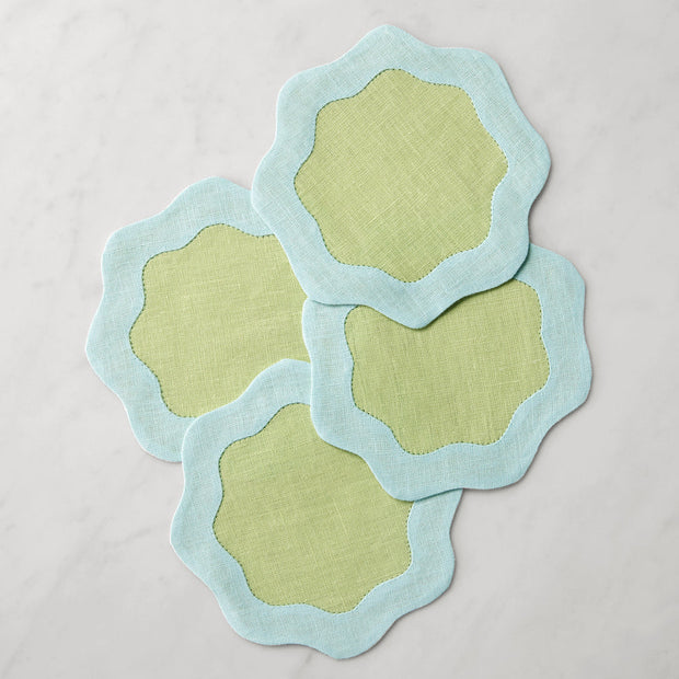 Set of six Sferra Ondulato cocktail napkins in forest celadon with elegant wavy pattern, perfect for stylish gatherings.