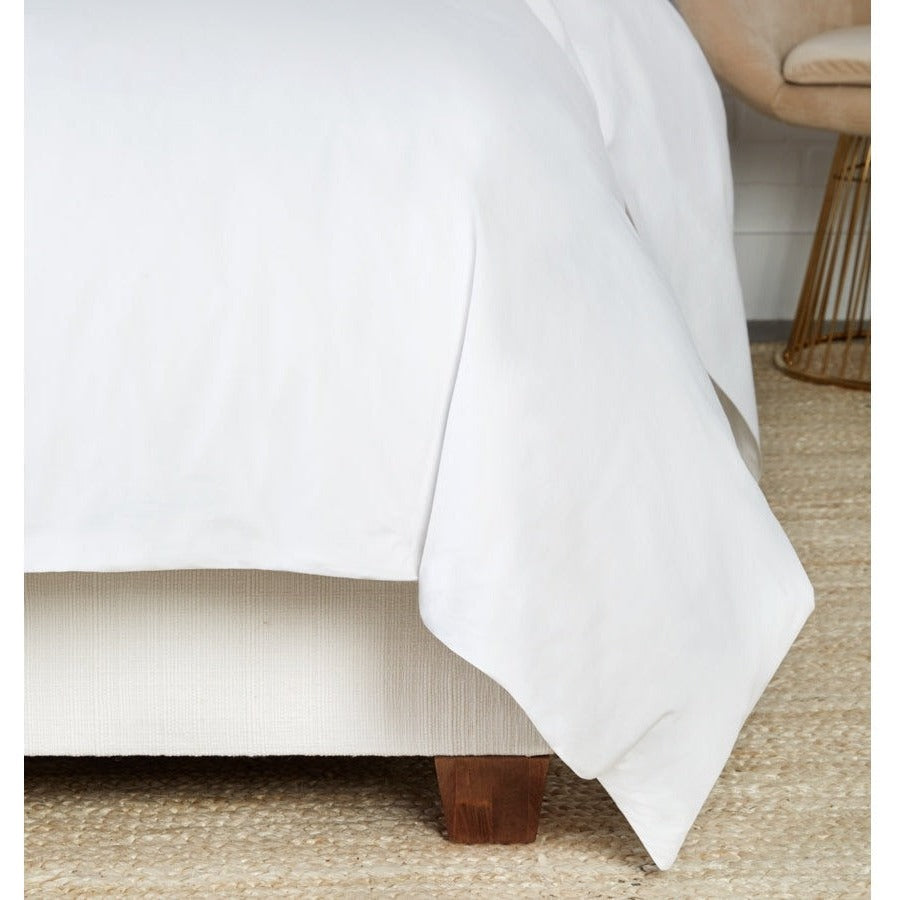 White Sferra Celeste duvet cover for queen size bed, featuring soft, luxurious fabric and elegant design.