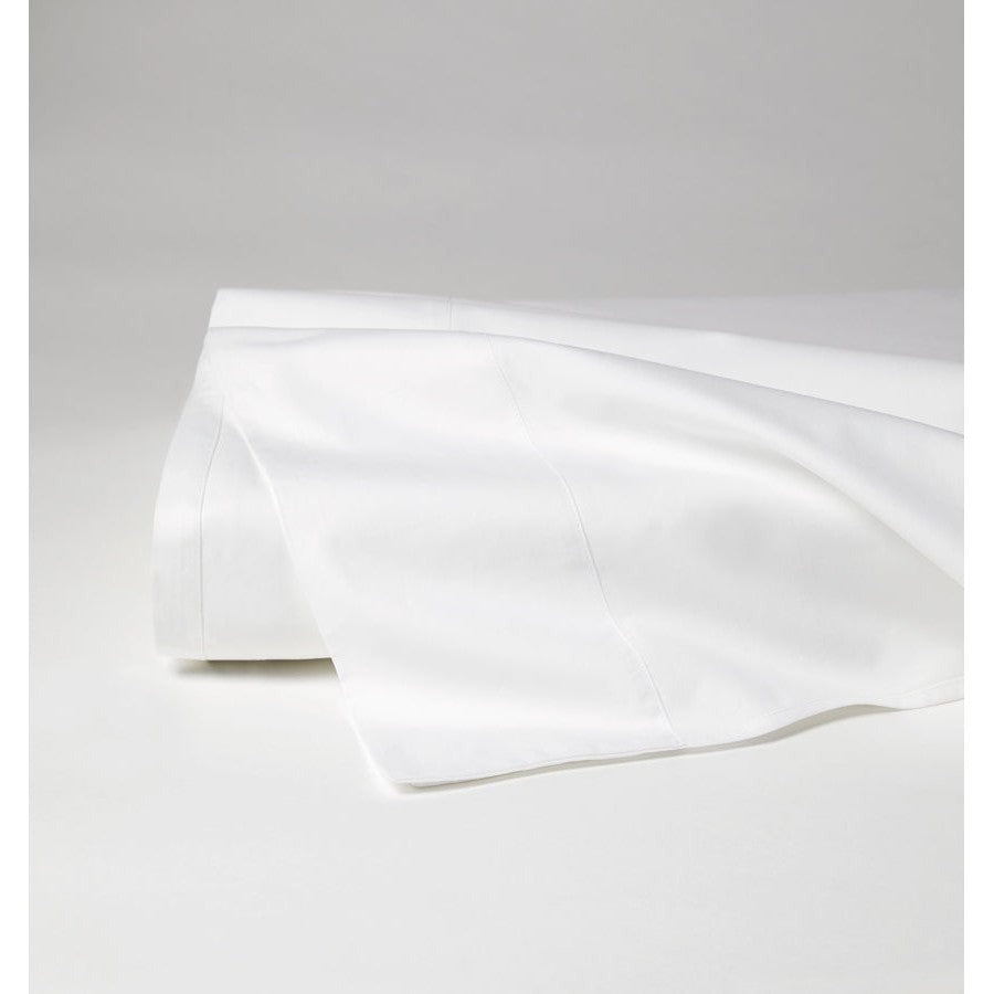 White Sferra Celeste flat sheet for queen size bed, soft and smooth fabric with neatly folded edges.