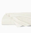 White Sferra Celeste flat sheet for queen bed, soft and smooth luxury linen fabric, shown spread neatly on a bed.