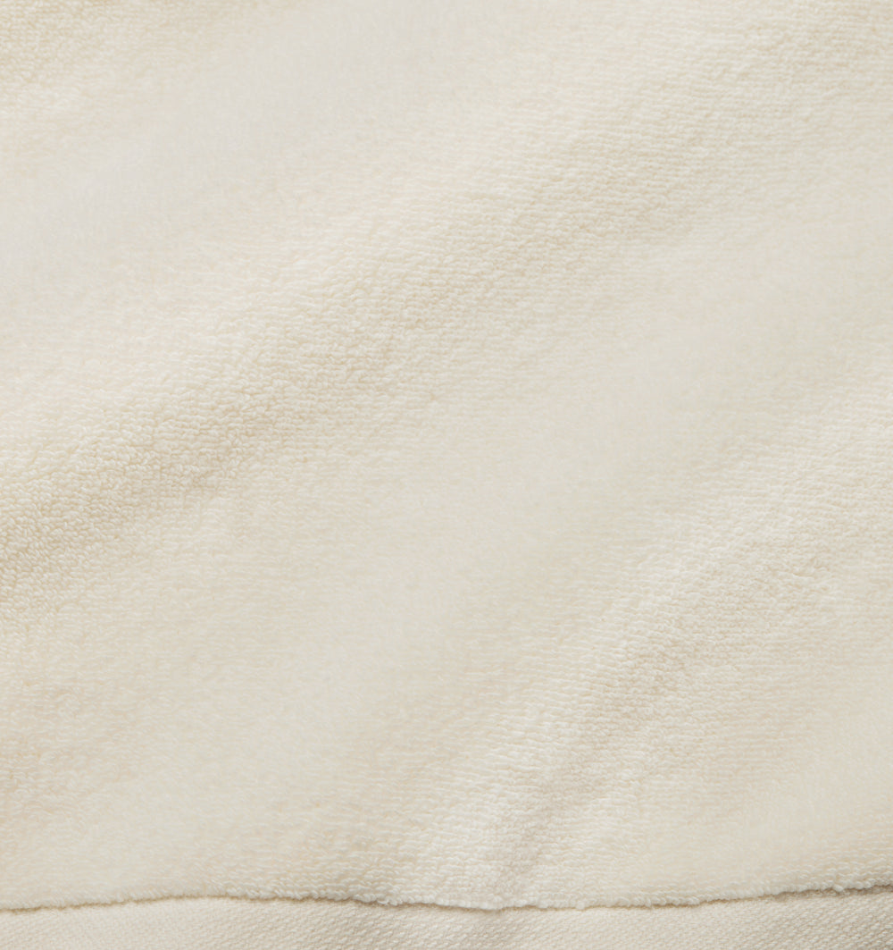 Ivory Sferra Cielo hand towel with soft, plush fabric and elegant texture, ideal for bathroom or guest use.