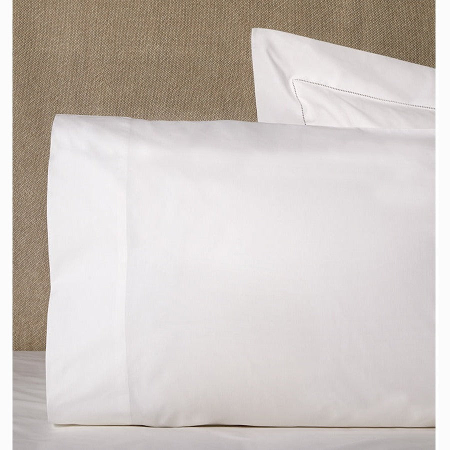Pair of white Sferra Celeste pillowcases showing smooth fabric and elegant stitching for a luxurious bedroom look.