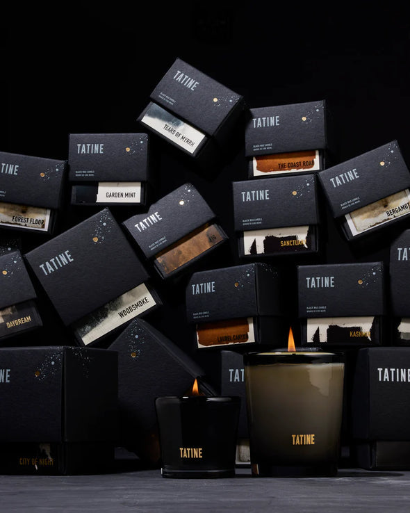 Tatine Stars Are Fire Classic Scented Candle with a warm, inviting design in a glass container, perfect for cozy ambiance.