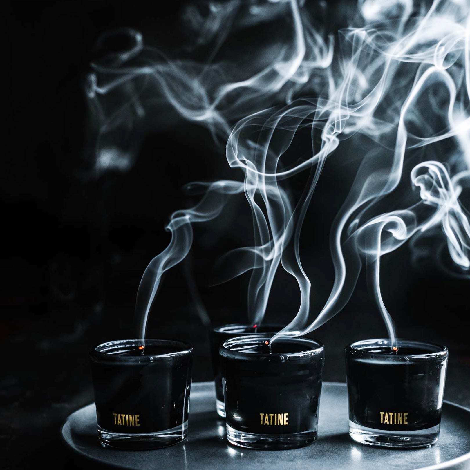 Tatine Stars Are Fire Classic Scented Candle with a decorative star-shaped design in a glass jar.