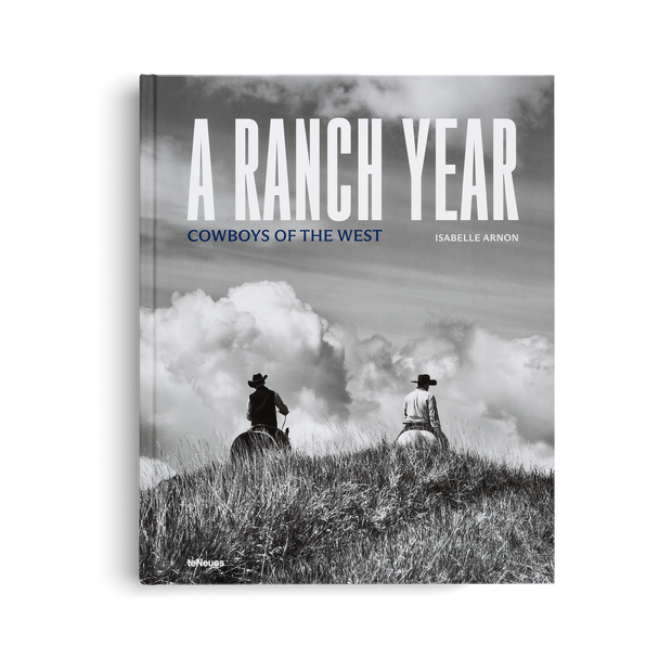 Decor book titled "A Ranch Year: Cowboys of the West" by TeNeues, featuring images of ranch life and Western cowboy scenes.