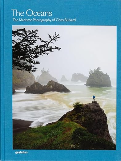 Decor book titled "The Oceans" featuring maritime photography by Chris Burkard, showcasing ocean scenes and coastal landscapes.