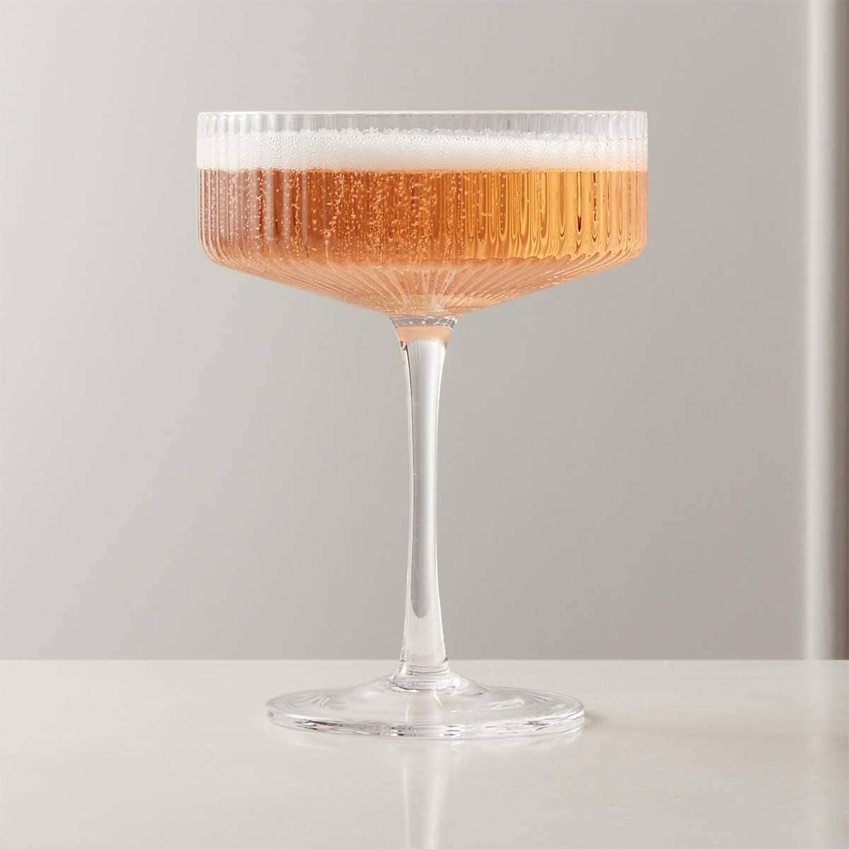 Ribbed vintage Art Deco coupe glass from The Wine Savant Khen Glassware, showcasing its elegant ribbed design and classic shape.