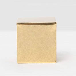 Gold box with lid on a light gray background