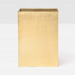 Gold rectangular wastebasket on a white background