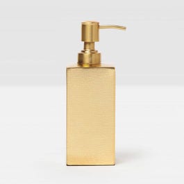 Gold soap dispenser on a light gray background