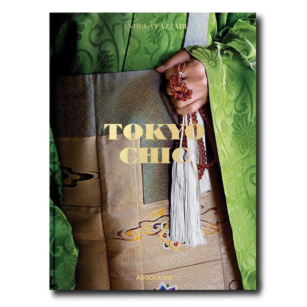 Book cover of 'Tokyo Chic' by Assouline with a hand holding a decorative object.