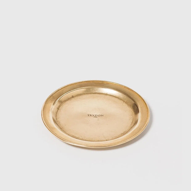 Trudon brass candle accessory base with a sleek, polished finish, designed to hold and stabilize candles securely.
