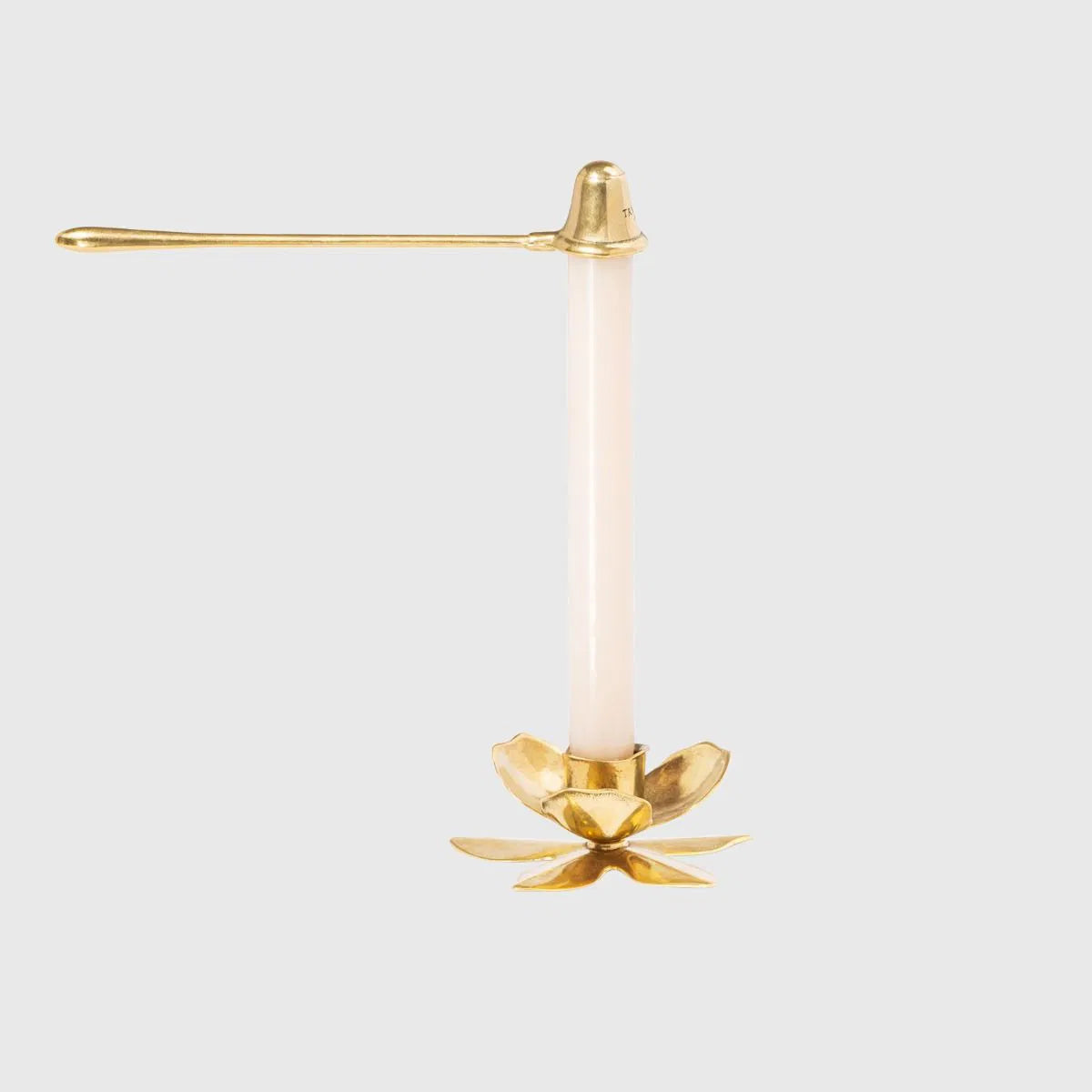 Trudon brass candle snuffer for candle accessories, with a sleek metallic finish and a rounded handle.