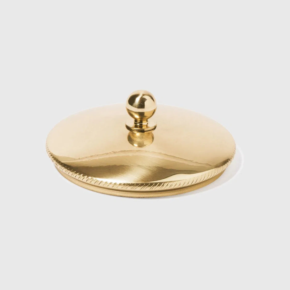 Trudon brass candle topper for candle accessories, featuring a sleek, polished brass design to enhance candle safety and style.