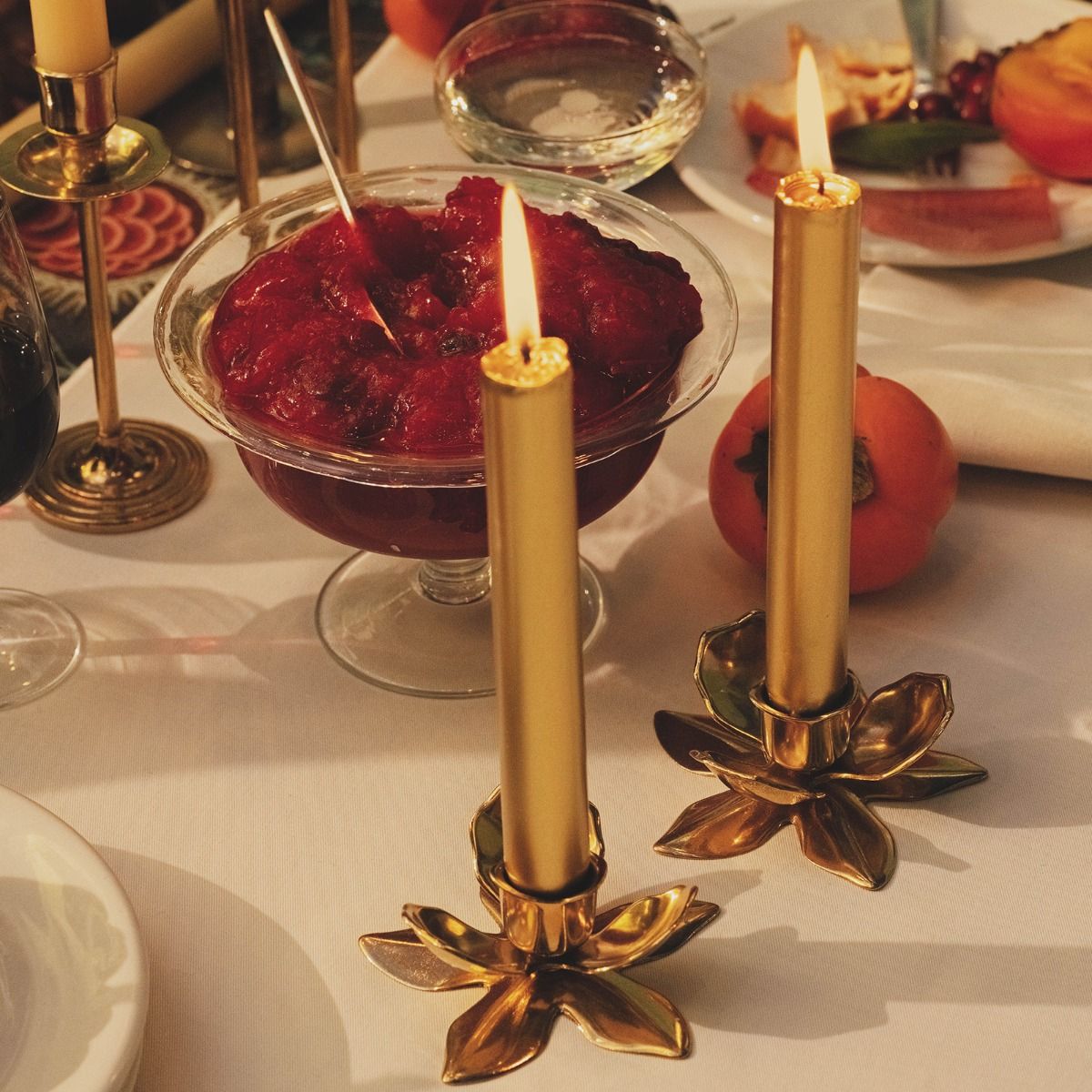 Brass flower-shaped candle holder by Trudon, an elegant candle accessory with intricate floral design for decorative use.