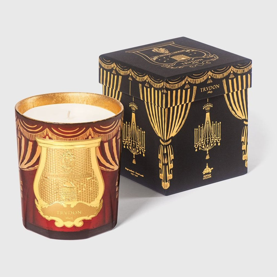 Trudon Holiday Scented Candle with orange and cinnamon aroma, elegant glass container, perfect for festive décor.