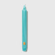 Six aqua Trudon Madeleine taper candles in a box, elegant and slender for decorative and ambient lighting.
