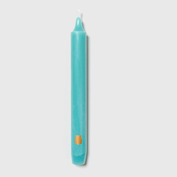 Six aqua Trudon Madeleine taper candles in a box, elegant and slender for decorative and ambient lighting.