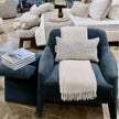 Verellen Murphy armchair with petrolium upholstery, featuring a stylish, comfortable armchair design in a modern living space.