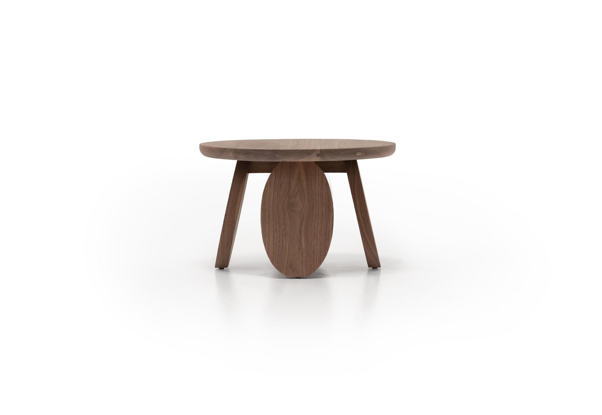 Verellen Olive Walnut Coffee Table with a smooth wooden surface and sturdy legs, showcasing elegant craftsmanship.