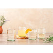 Clear handblown Mexican glassware by Verve Culture, showcasing elegant, transparent glass cups with intricate craftsmanship.