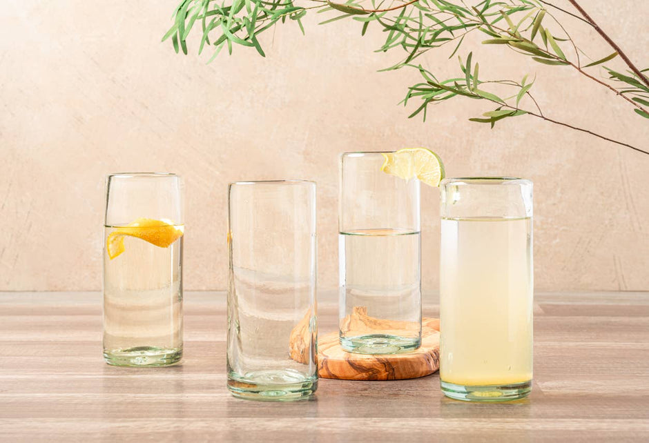 Set of clear handblown Mexican highball glasses by Verve Culture, showcasing smooth glassware with elegant, rounded shapes.