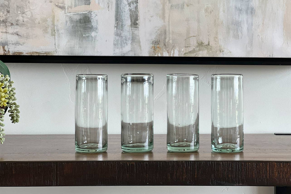 Set of clear handblown Mexican highball glasses by Verve Culture, showcasing intricate glass craftsmanship and elegant design.