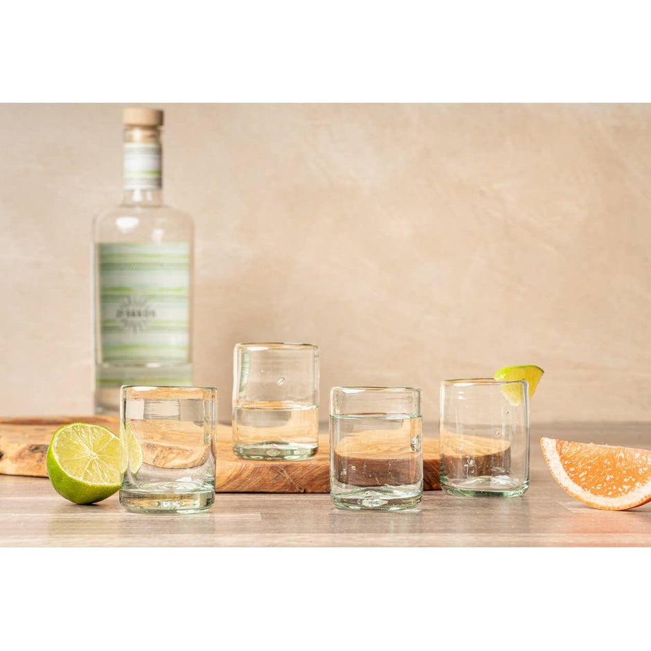 Set of clear handblown Mexican shot glasses by Verve Culture, showcasing smooth glass with unique handcrafted details.