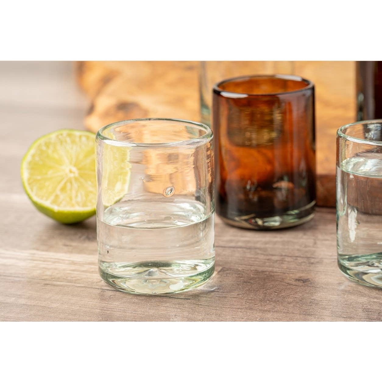 Set of clear handblown Mexican shot glasses by Verve Culture, showcasing artisanal glassware with distinctive craftsmanship.