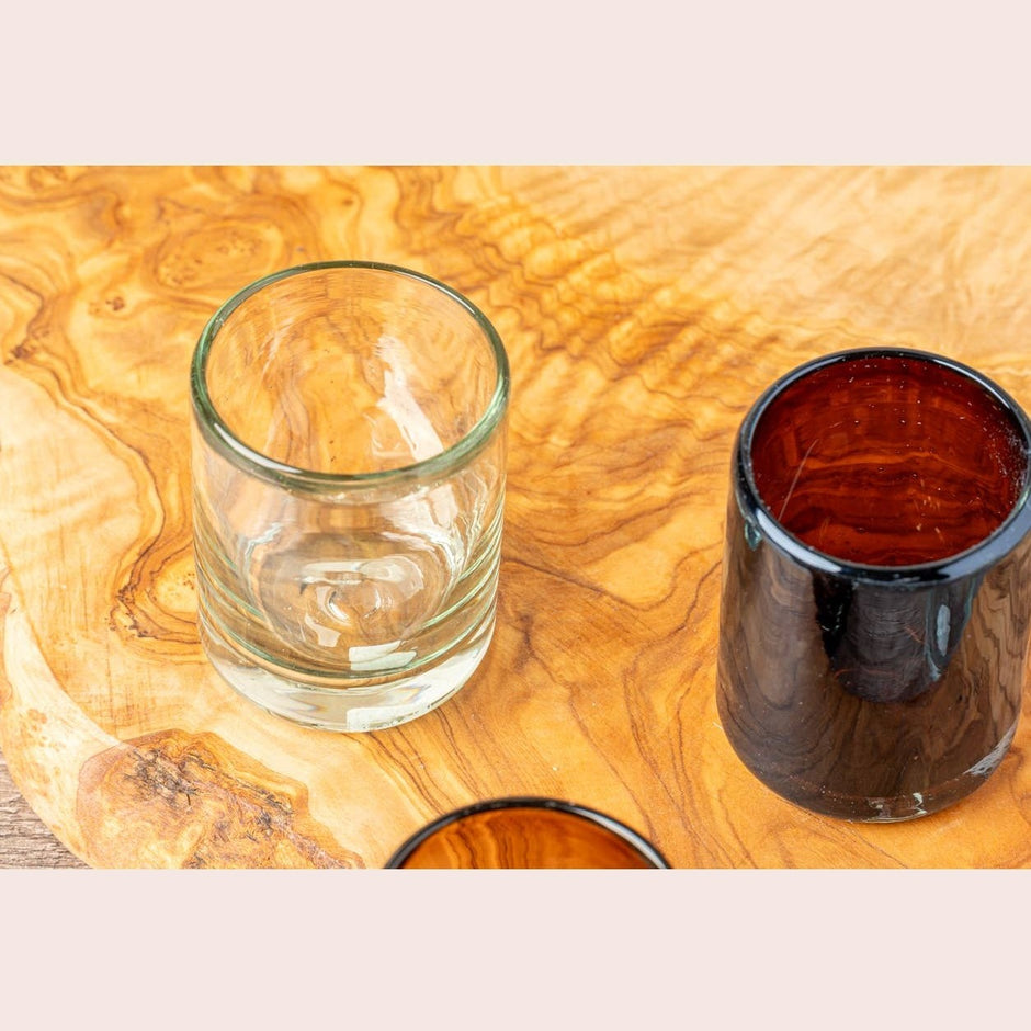 Set of clear, handblown Mexican shot glasses from Verve Culture, featuring artisanal glassware with a smooth, transparent finish.