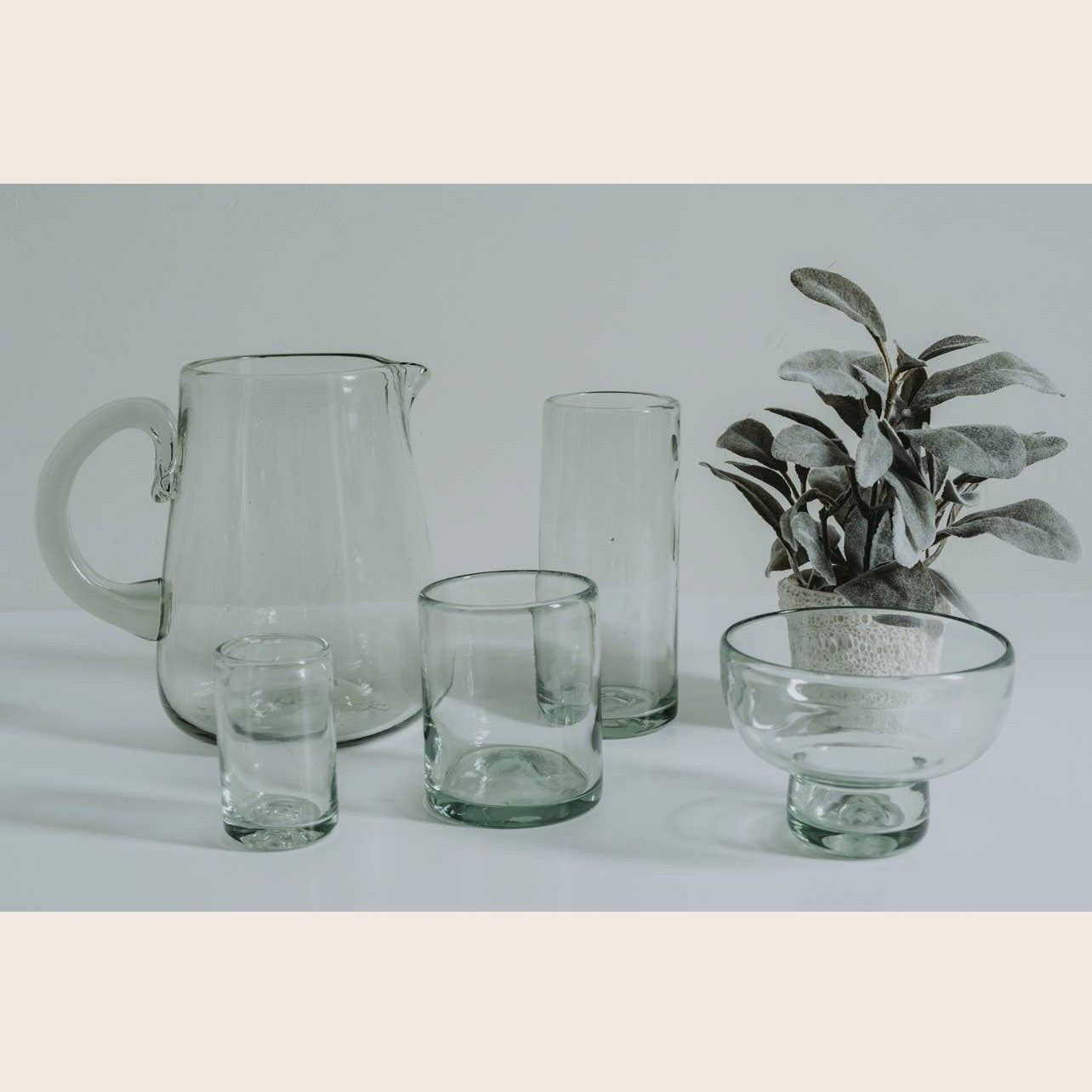 Set of clear handblown Mexican shot glasses by Verve Culture, showcasing intricate glassware craftsmanship.