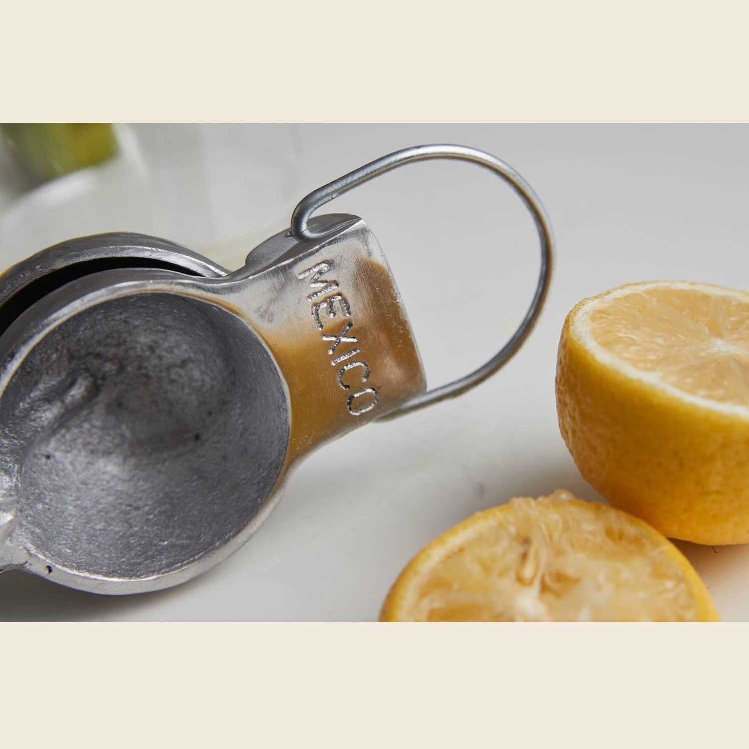 Mexican hand citrus juicer from Verve Culture, traditional manual tool for extracting juice from lemons and limes.