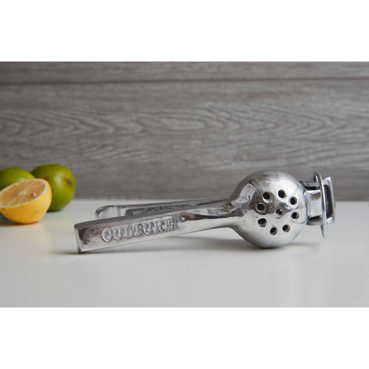 Mexican hand citrus juicer by Verve Culture, featuring traditional design for extracting juice from oranges, lemons, and limes.