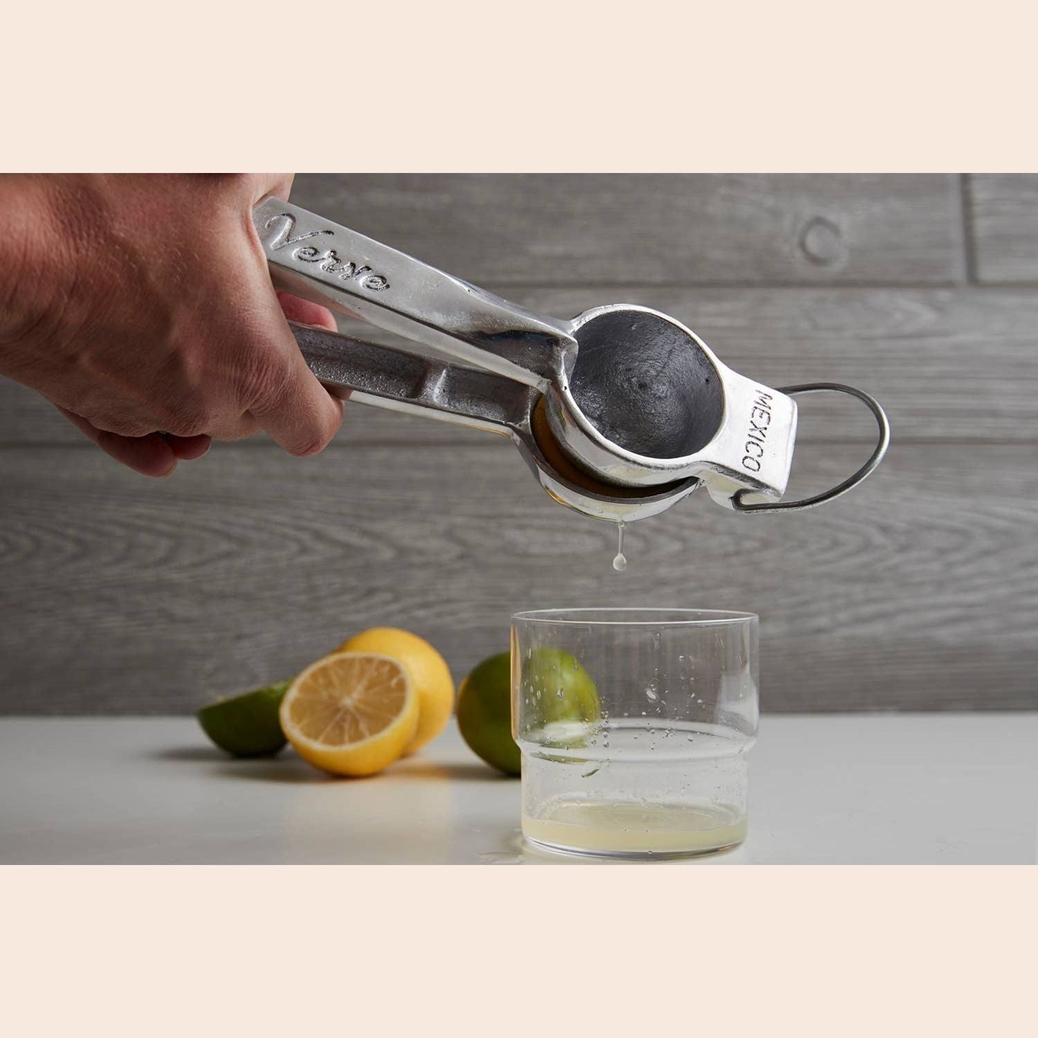 Mexican hand citrus juicer by Verve Culture, traditional manual juicer for fresh oranges and lemons.